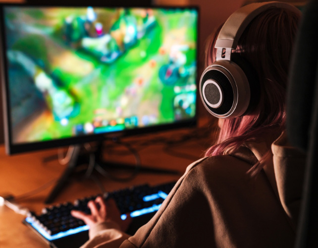 esport girl with headphones playing game